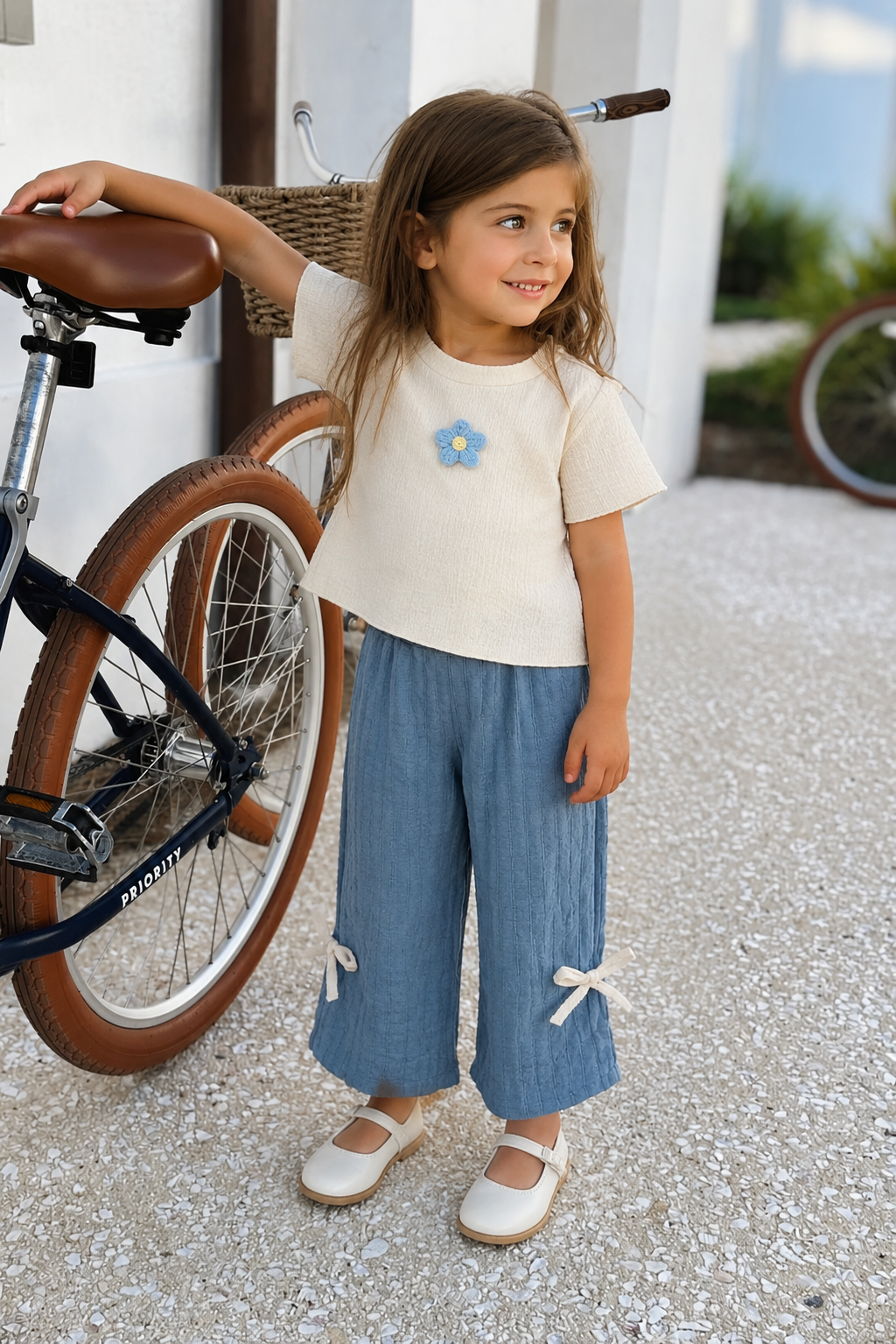 Girl wearing the Bluebell Breeze Set outdoors