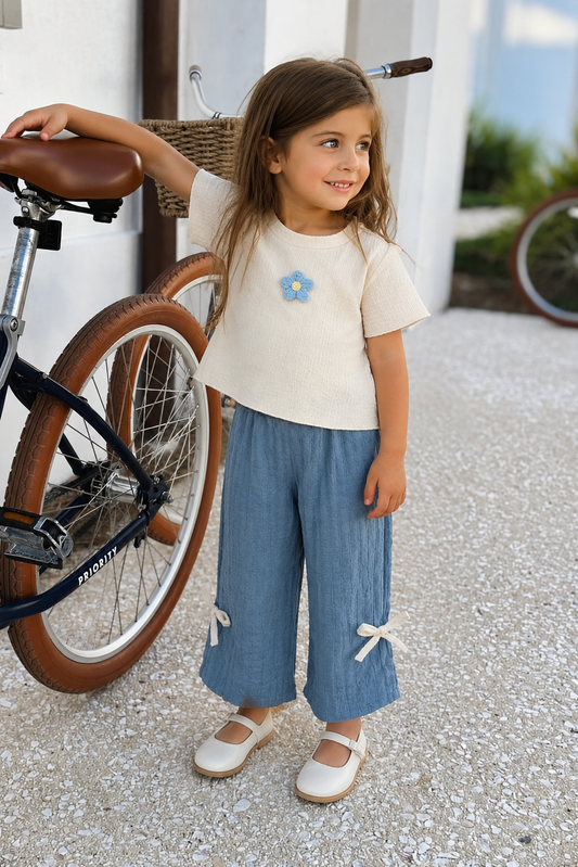 Girl wearing the Bluebell Breeze Set outdoors
