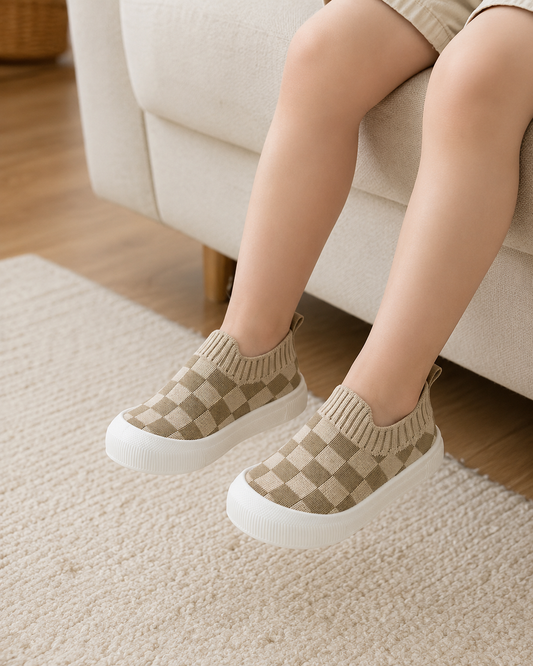 Baby wearing Sunday Check Knit Shoes indoors