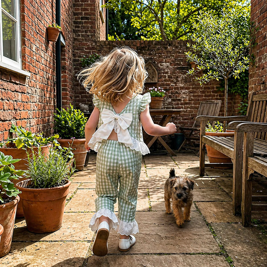 Girl wearing the Lottie Gingham Set with bow-back detail