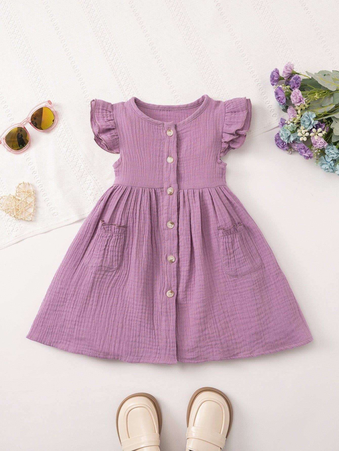 Special occasion dress featuring Meadow Button Dress for festive occasions