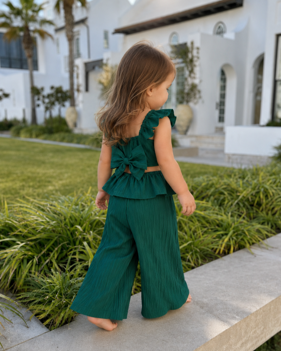Girl wearing the Lilia Bow Set outdoors