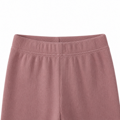Close-up of the elastic waistband and ribbed texture on the mauve leggings.