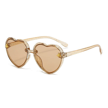 Brown heart sunglasses for girls with stylish frame design and UV400 sun protection lenses.
