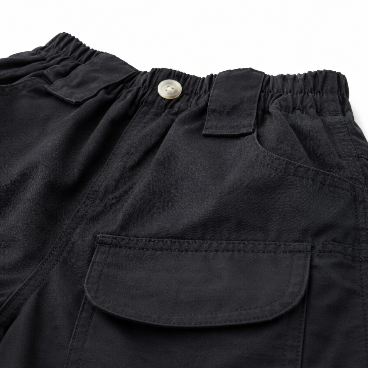 Black boys cargo shorts waistband, belt loops and front utility pocket detail