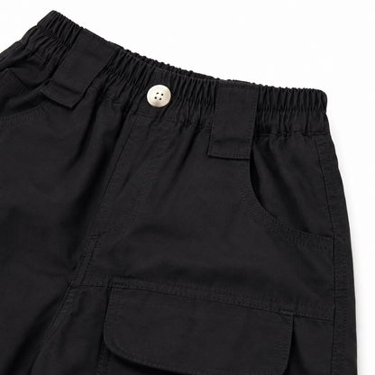 Black cotton cargo shorts front pocket and elastic waistband detail