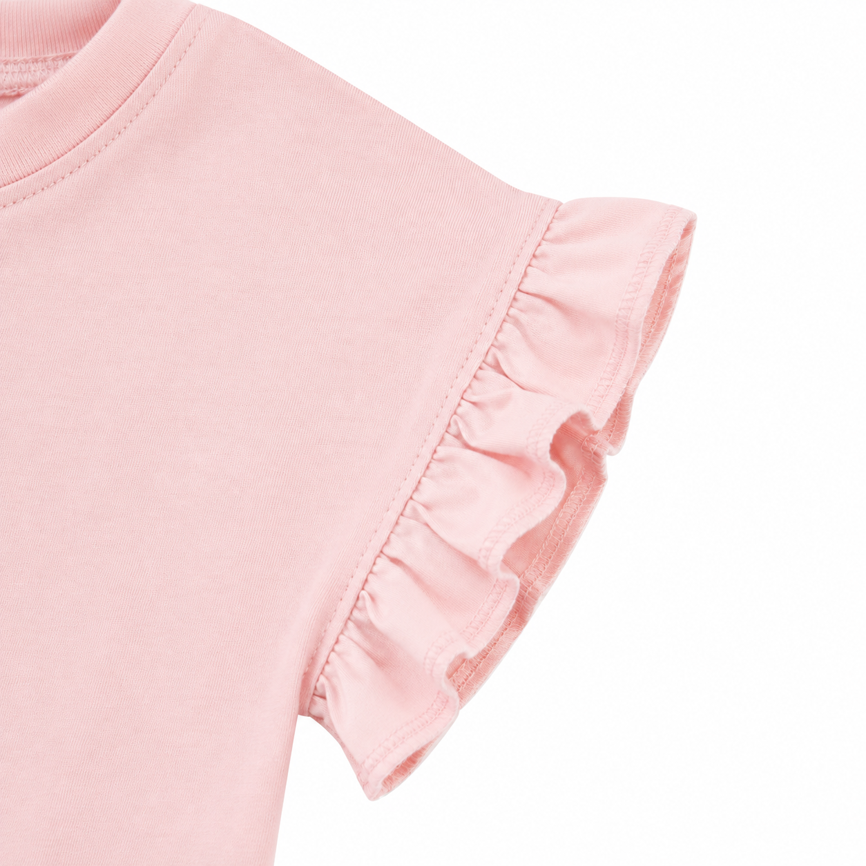 Close-up of the ruffle sleeve detail on the blush pink girls cotton top.