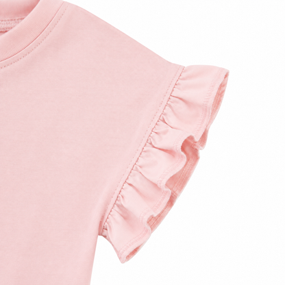 Close-up of the ruffle sleeve detail on the blush pink girls cotton top.
