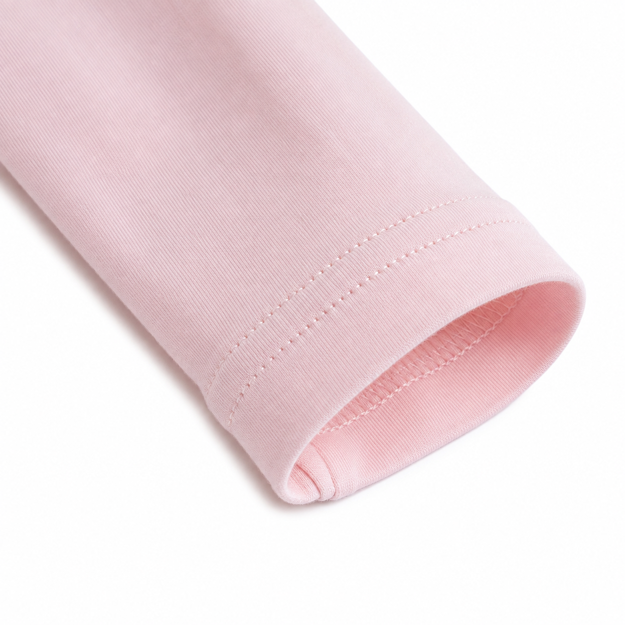 Close-up of the long sleeve cuff stitching on the Blush Pink girls cotton top.