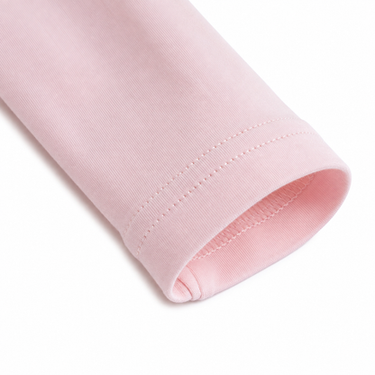 Close-up of the long sleeve cuff stitching on the Blush Pink girls cotton top.
