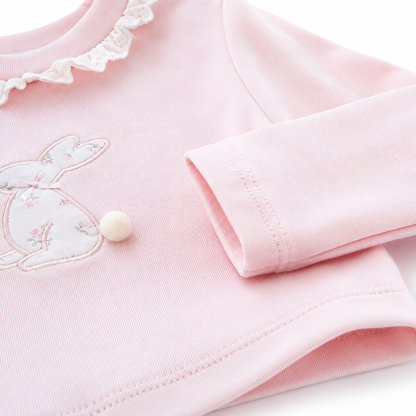 Close-up of the cotton fabric and construction detail on the Blush Pink girls long sleeve top.