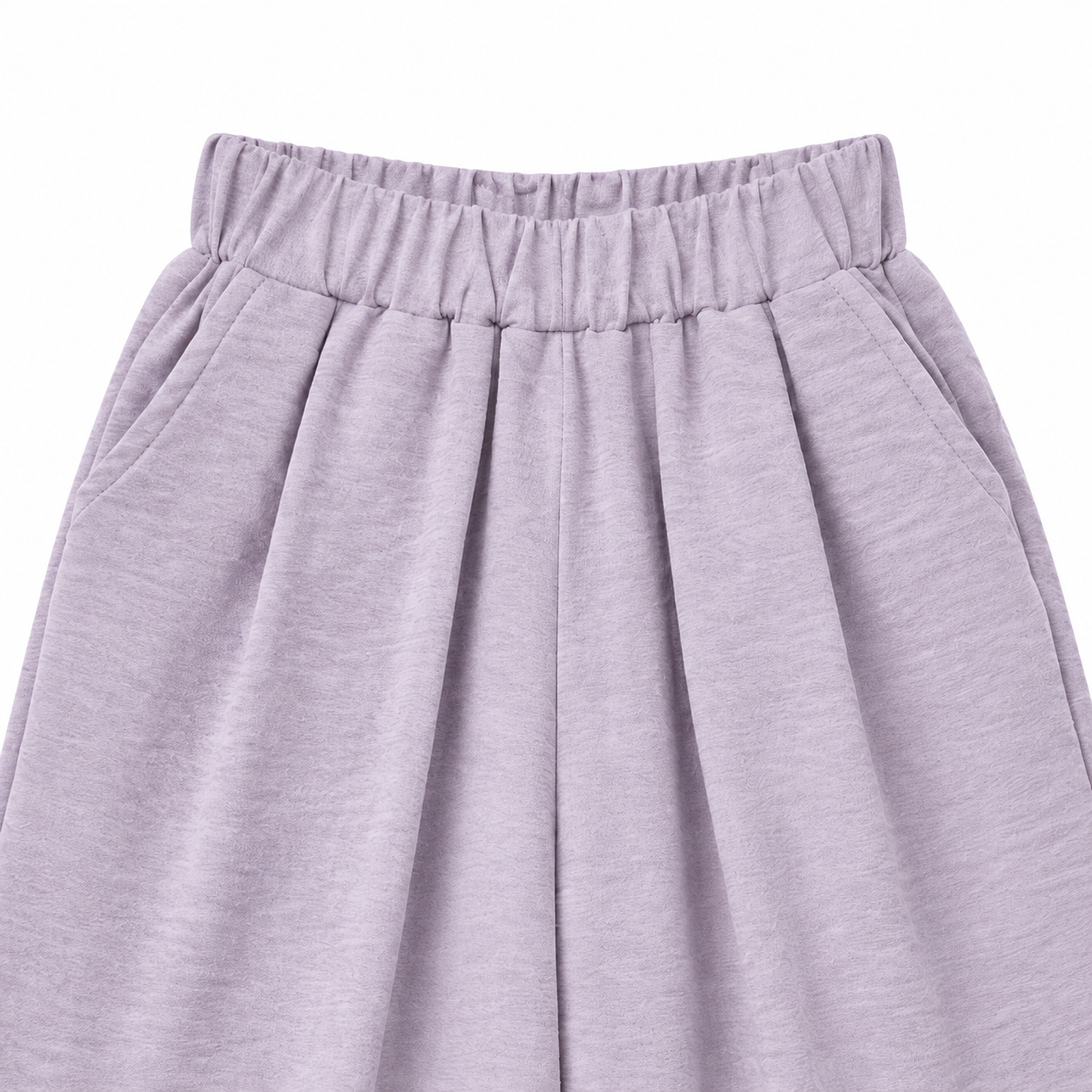 Close-up of the pleated elastic waistband on the lavender culotte pants.