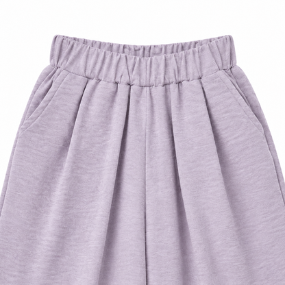 Close-up of the pleated elastic waistband on the lavender culotte pants.