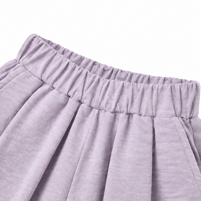 Close-up of the elastic waist construction on the lavender girls pants.