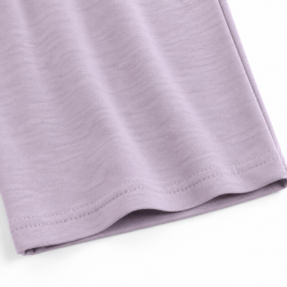 Close-up of the fabric texture and hem on the lavender culotte pants.