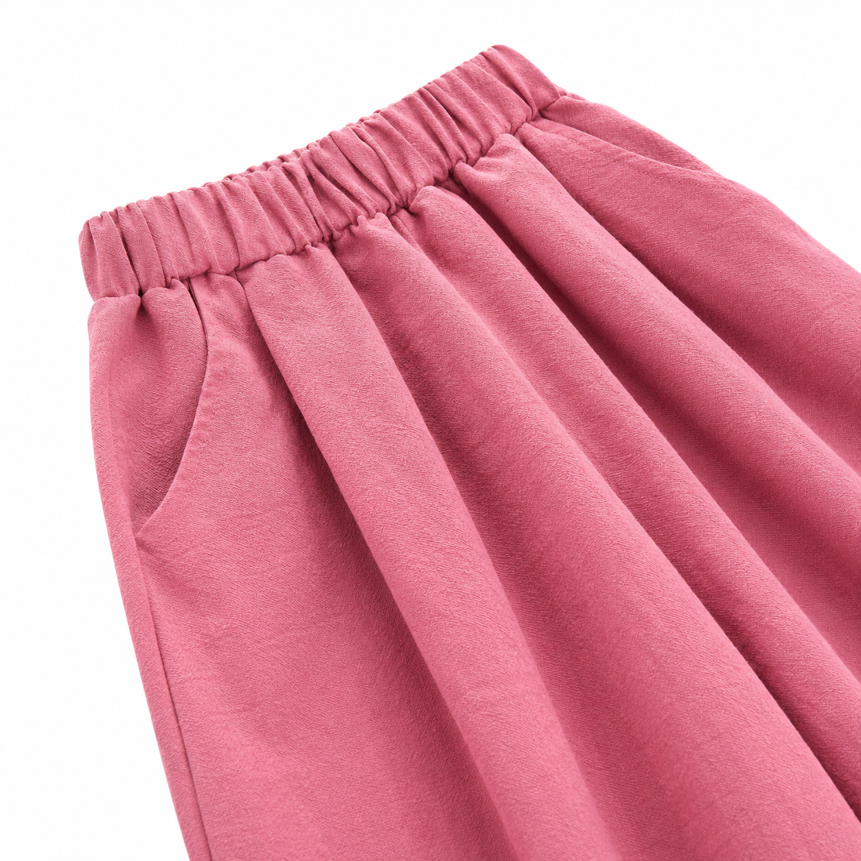 Close-up of the side pocket and wide-leg shape on the rose pink pants.