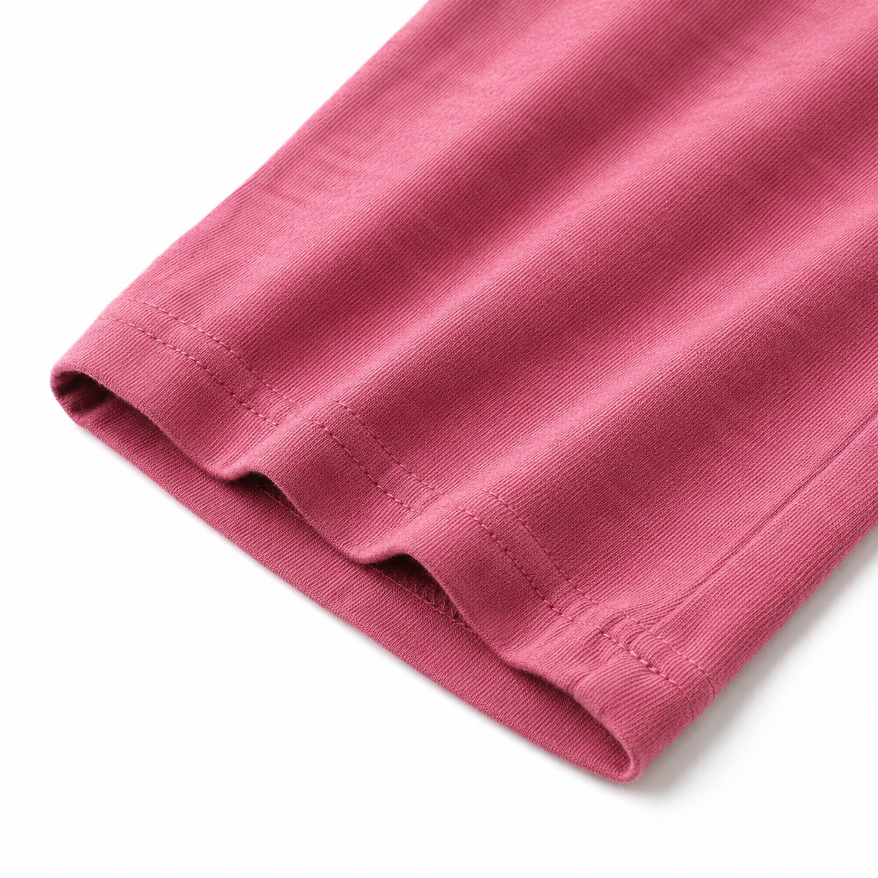 Close-up of the fabric texture and hem on the rose pink culotte pants.