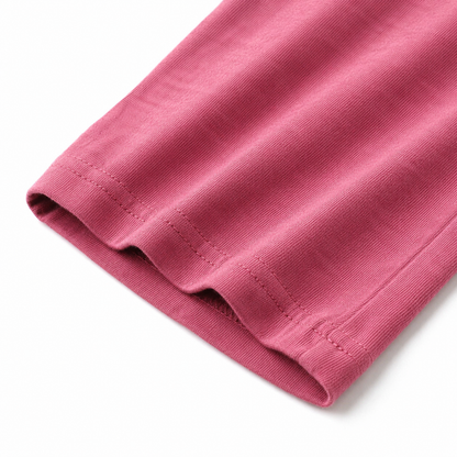 Close-up of the fabric texture and hem on the rose pink culotte pants.