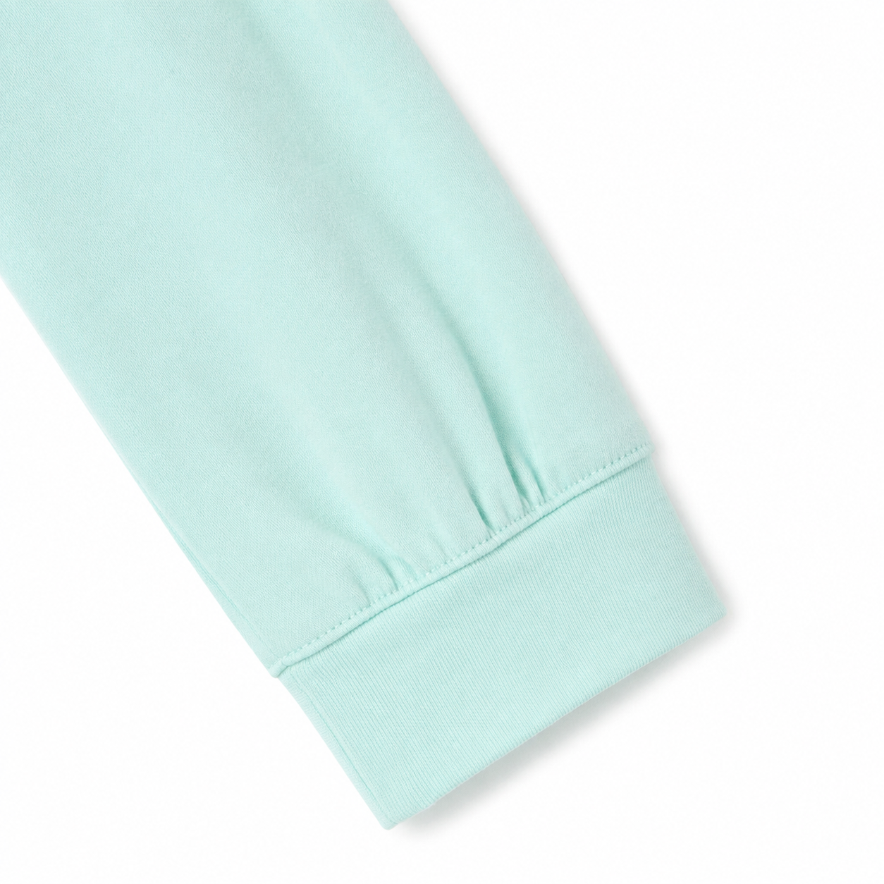 Close-up of the long sleeve cuff detail on the mint green girls tulle dress.