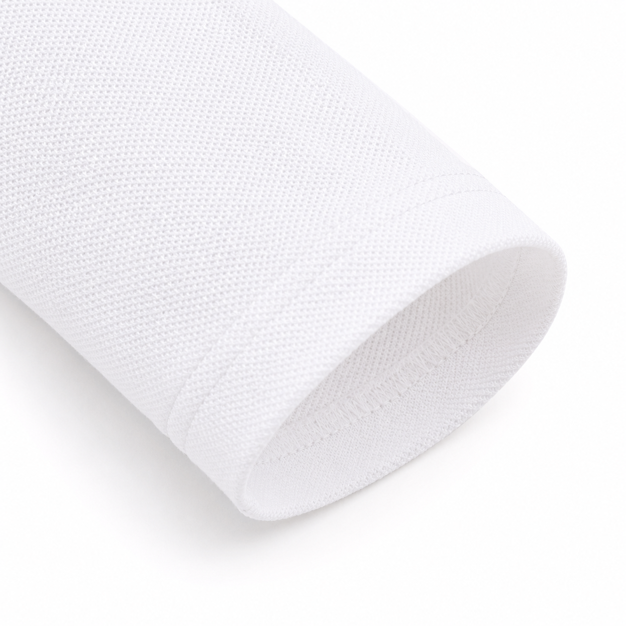 Close-up of the long sleeve and cotton-blend fabric on the white kids polo.