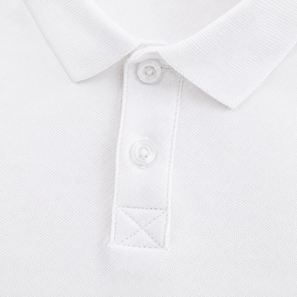 Close-up of the collar and button placket construction on the white long sleeve polo.
