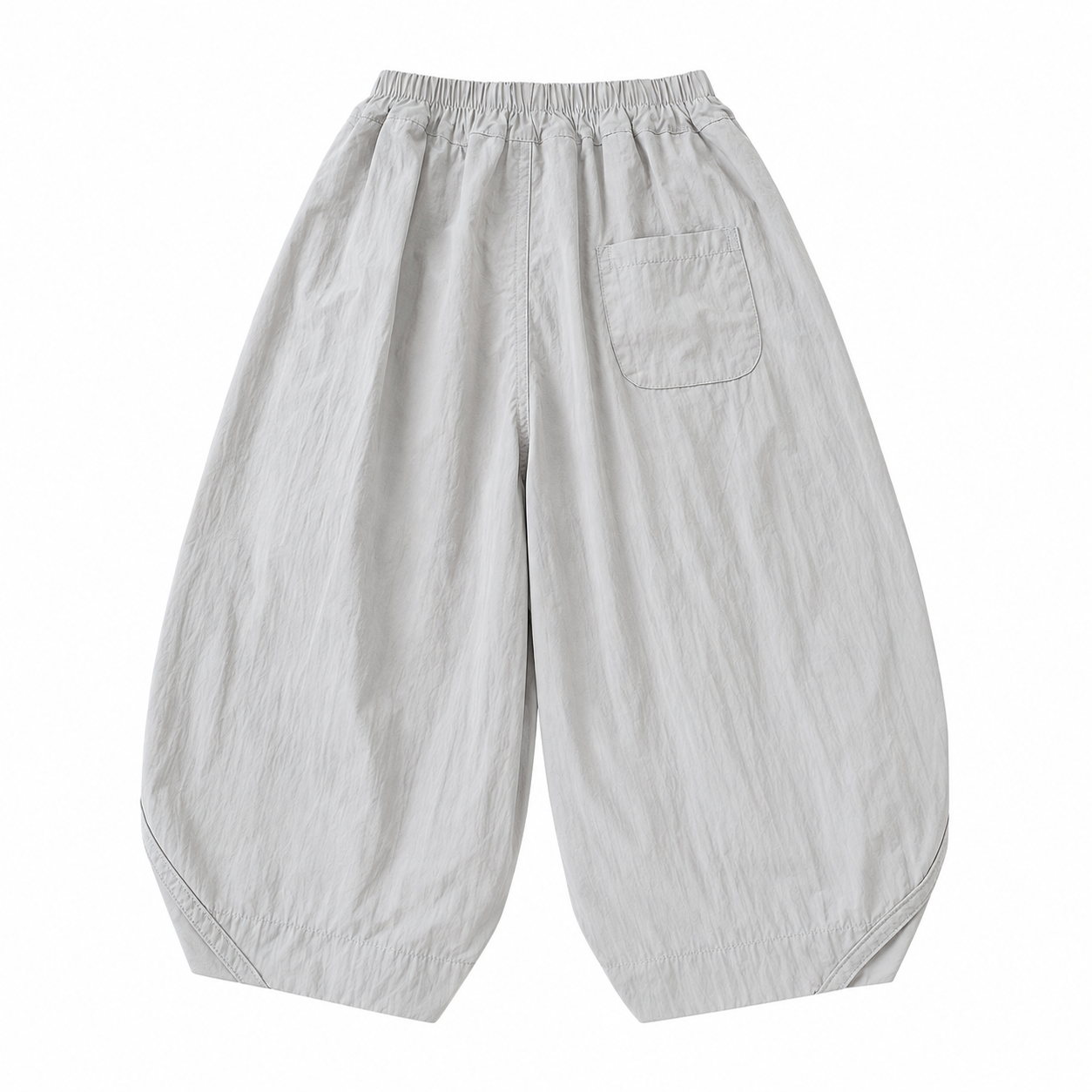 Back flat lay of the light gray kids balloon pants showing the rear patch pocket.