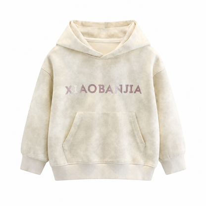 Front flat lay of the cream kids cotton pullover hoodie with soft washed texture.