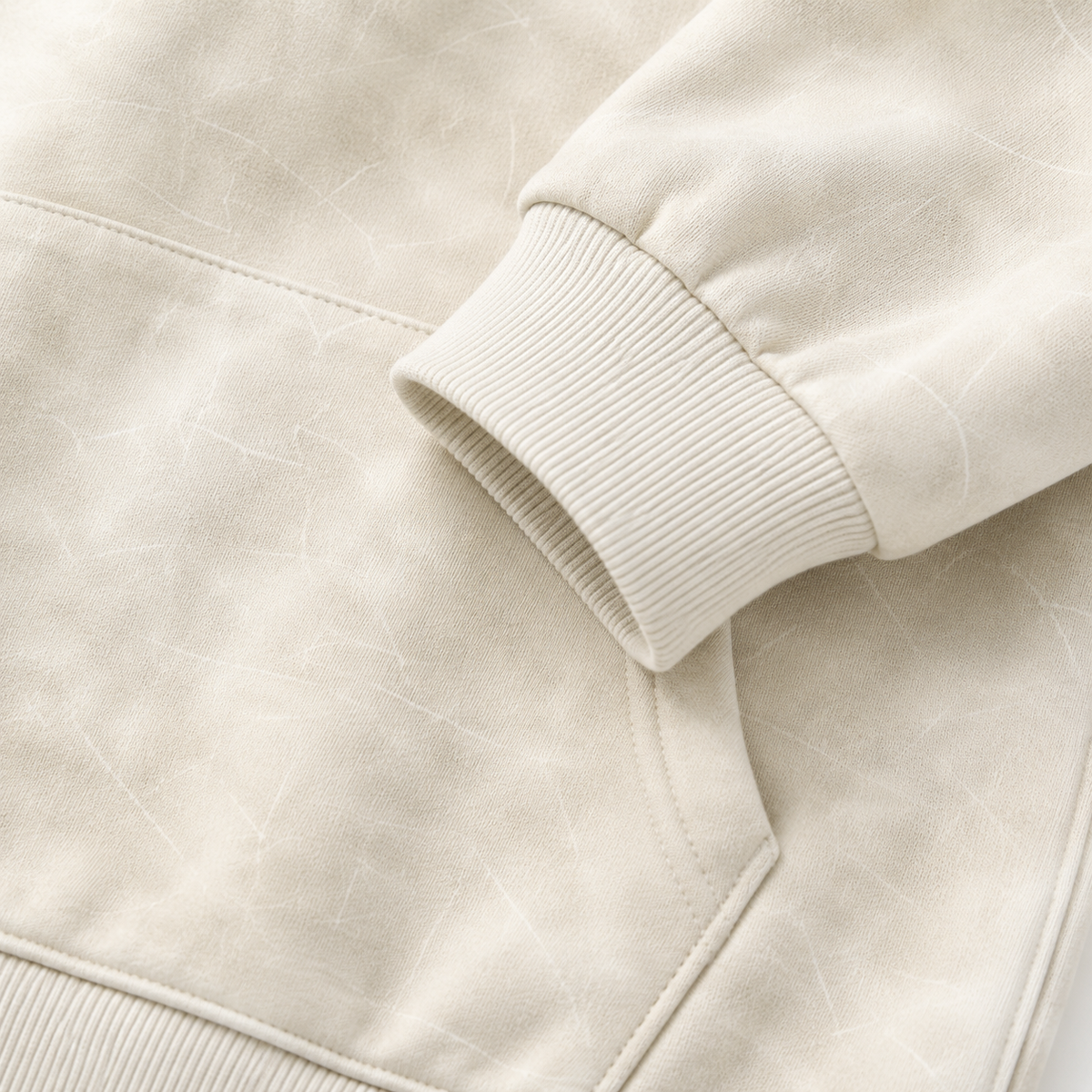 Close-up of the cotton fabric texture and kangaroo pocket detail.