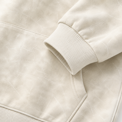 Close-up of the cotton fabric texture and kangaroo pocket detail.