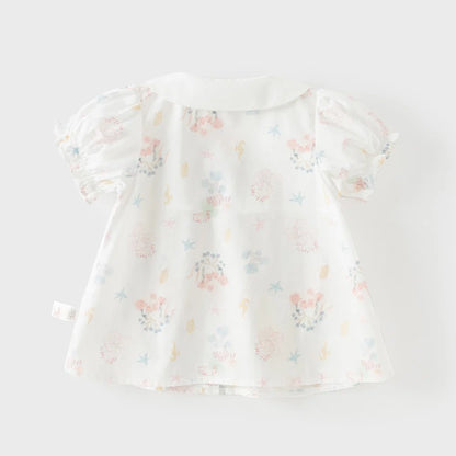 Back view of the white girls cotton blouse with pastel starfish, shells, coral and floral print.