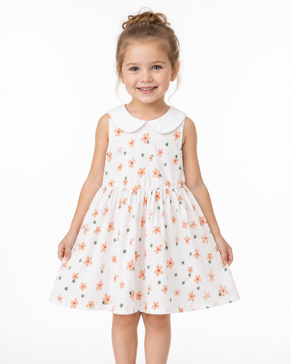 Girl model wearing the Coral Floral sleeveless cotton dress.