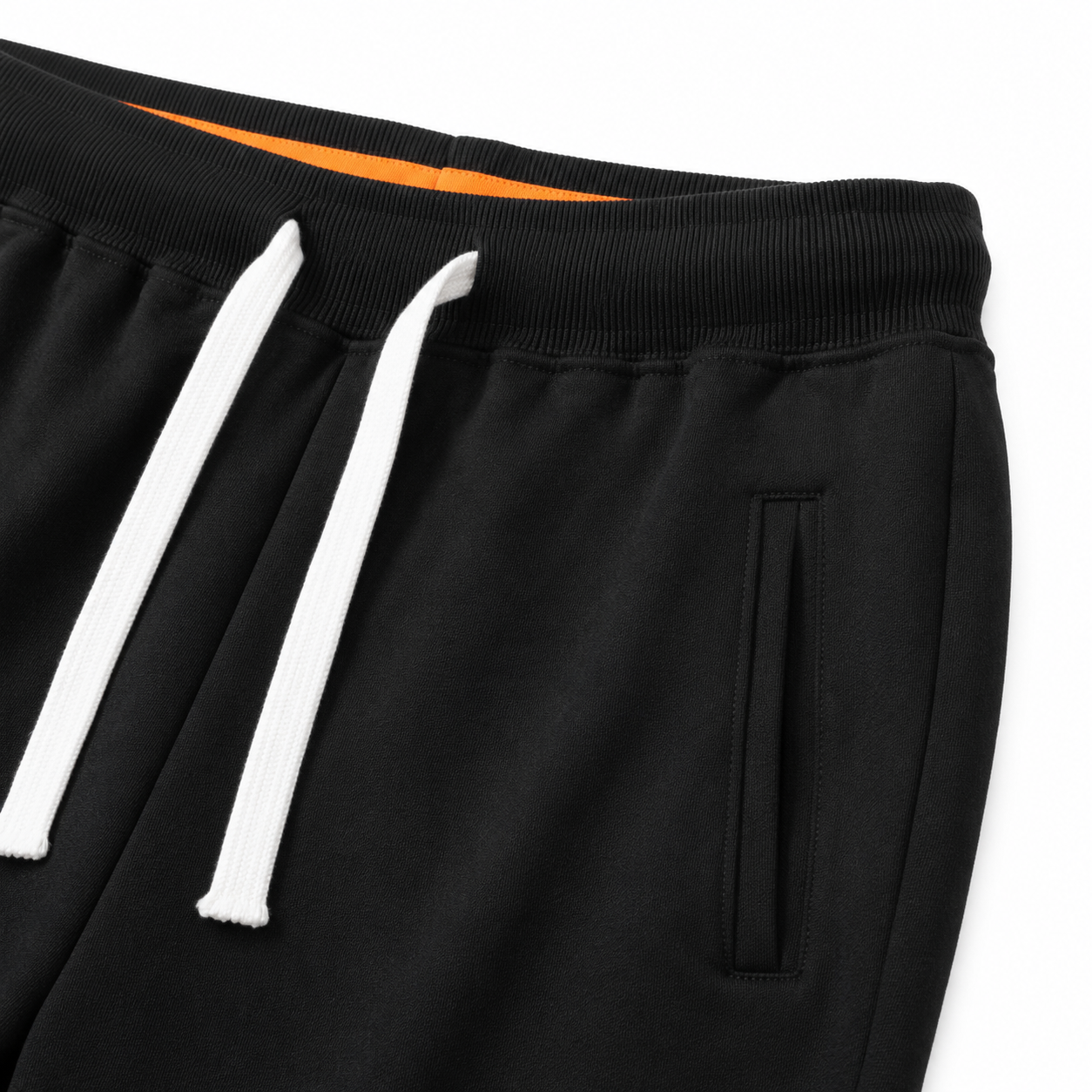 Close-up of the elastic waistband and contrast drawstring on the black kids jogger pants.