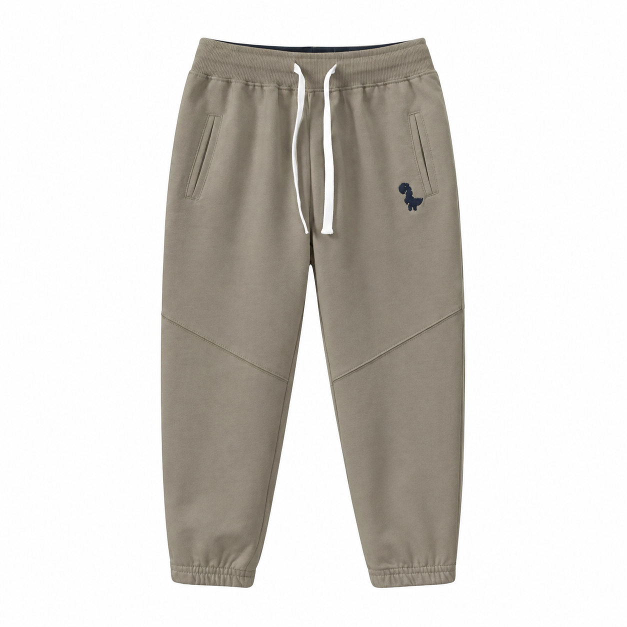 Front flat lay of the taupe kids cotton jogger pants with drawstring waist and dinosaur detail.