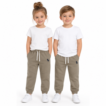 Girl and boy models wearing the taupe unisex kids cotton jogger pants.