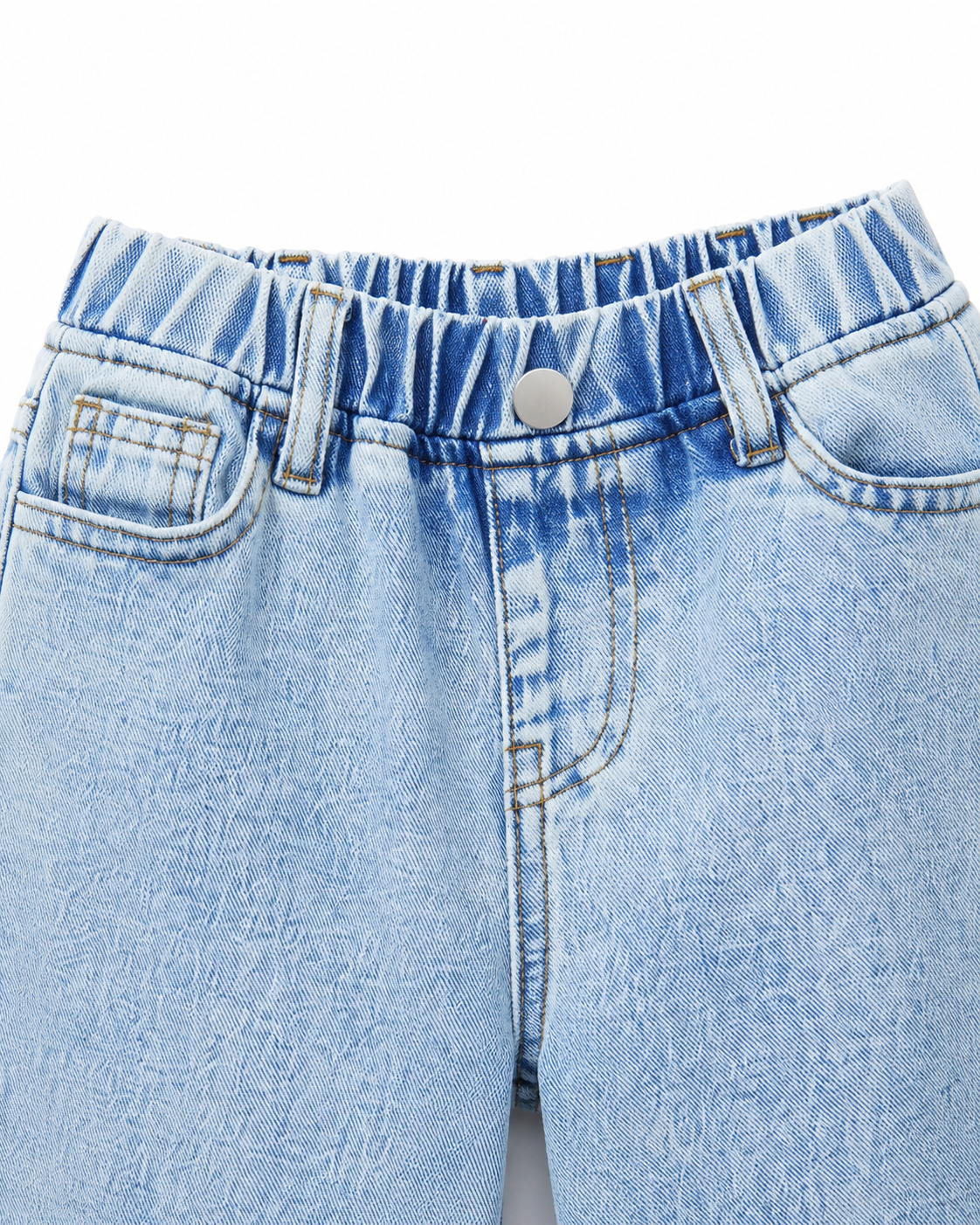 Close-up of the waistband, front button, and pocket construction on the light blue denim jeans.