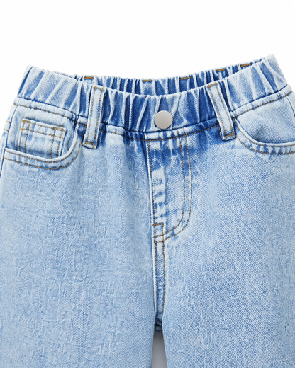 Close-up of the waistband, front button, and pocket construction on the light blue denim jeans.