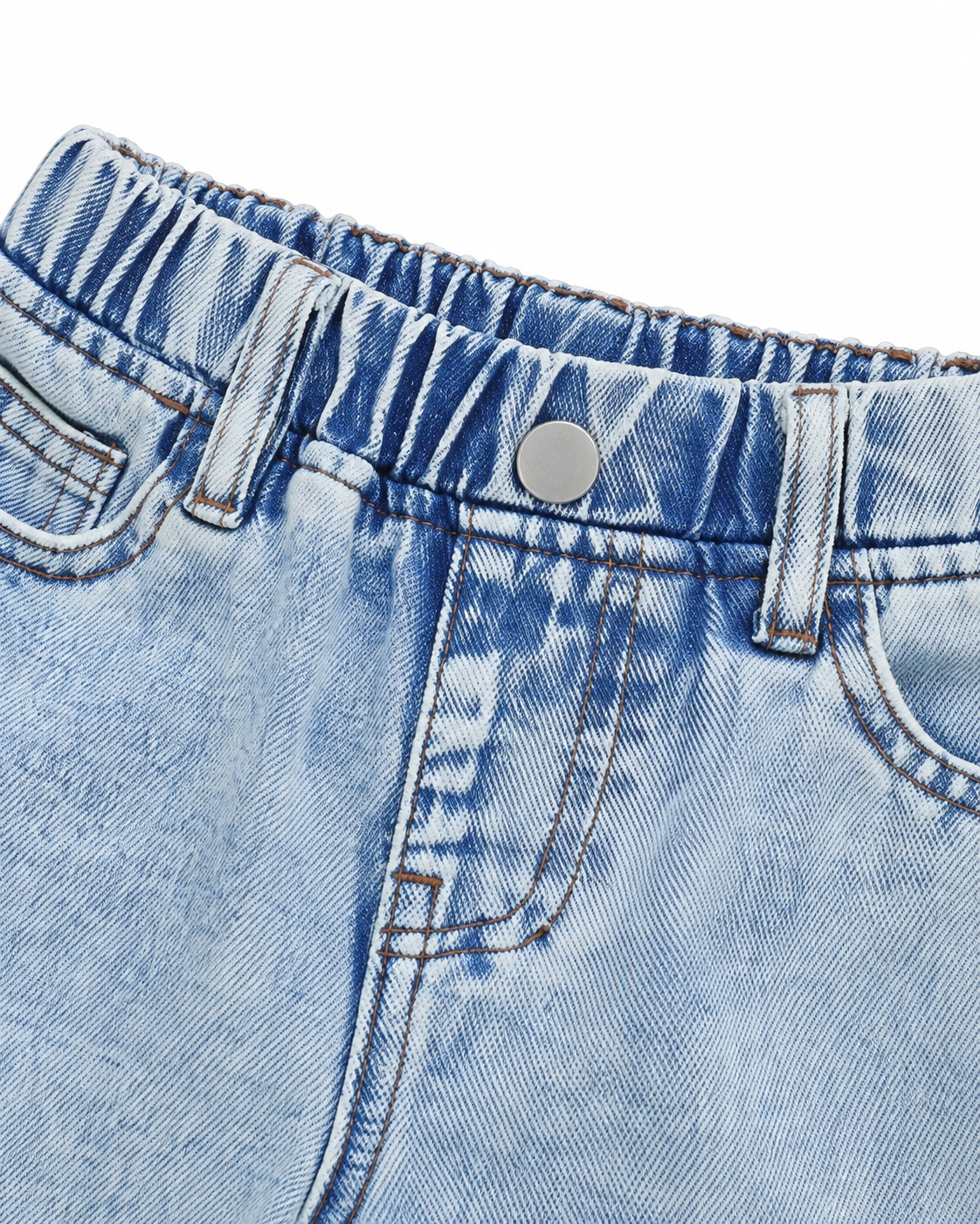 Close-up of the elastic back waistband and denim stitching on the light blue denim jeans.