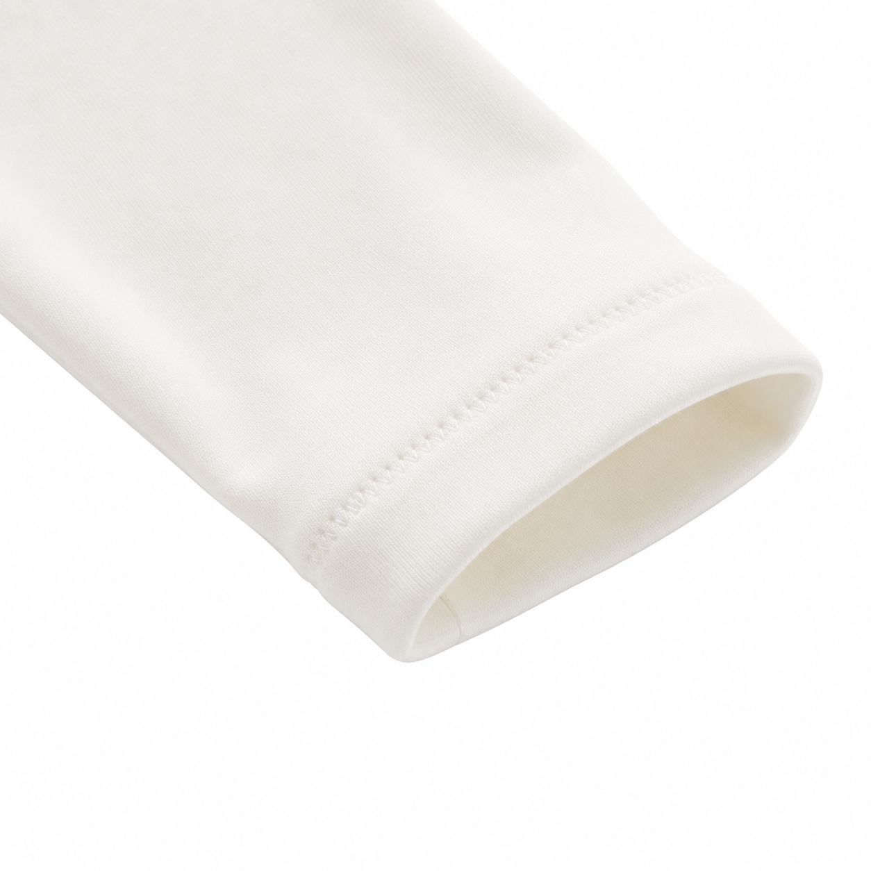 Close-up of the long sleeve cuff stitching on the Ivory girls cotton top.
