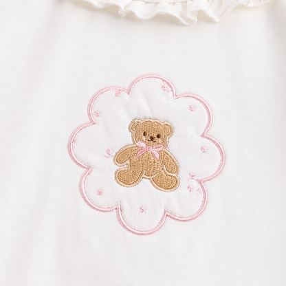 Close-up of the teddy bear framed by a flower outline on the Ivory girls cotton long sleeve top.