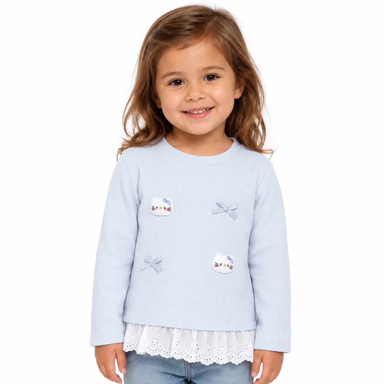 Girl model wearing a light blue long sleeve cotton ruffle top on a white studio background.