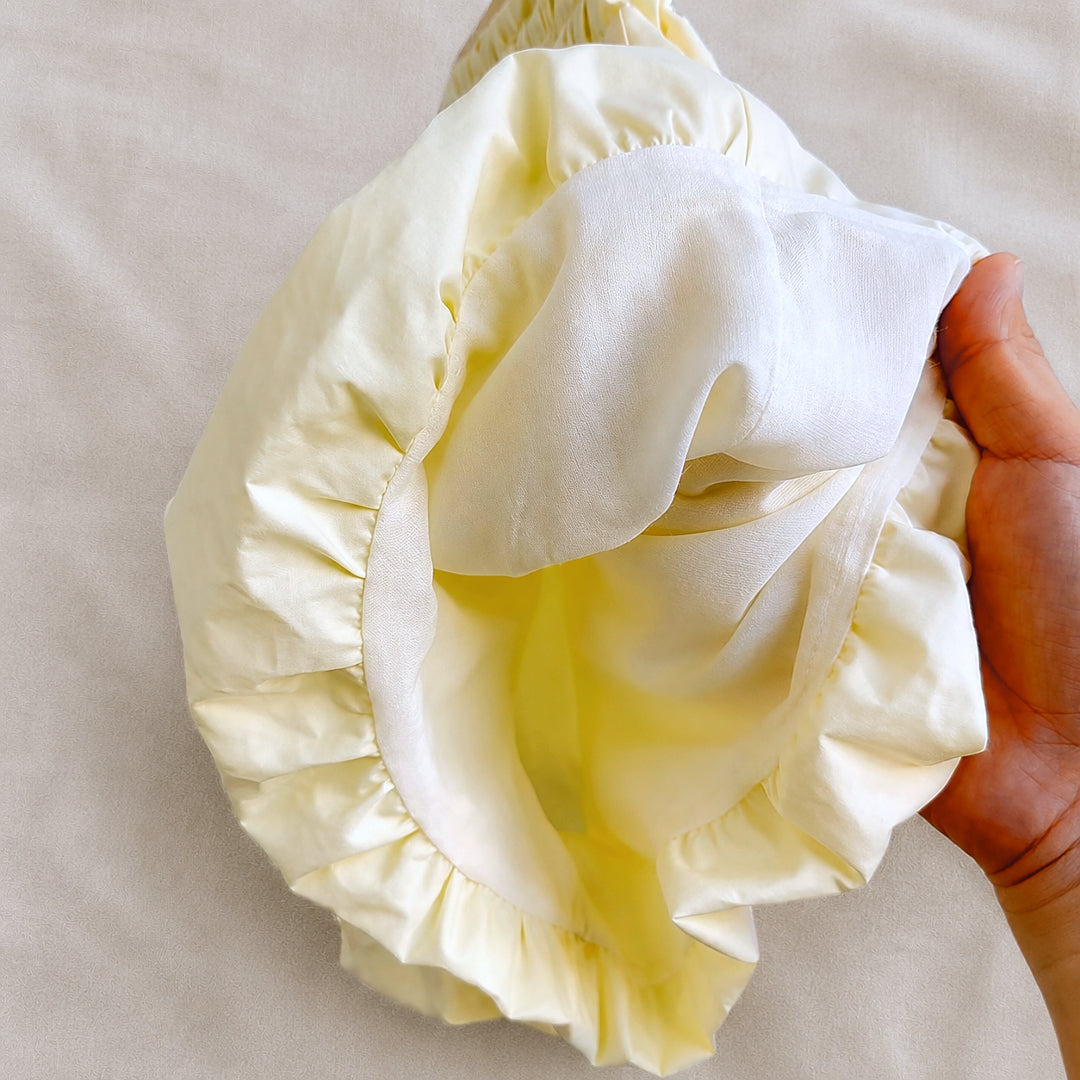 Close-up of the Lila Bloom Set bloomer shorts lining and soft ruffle hem detail.