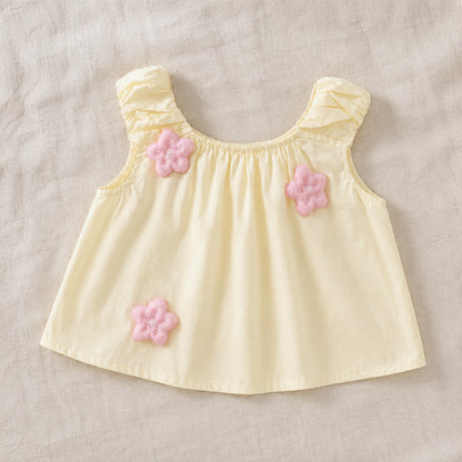 Front view of the Lila Bloom Set yellow sleeveless top with pink flower appliques.