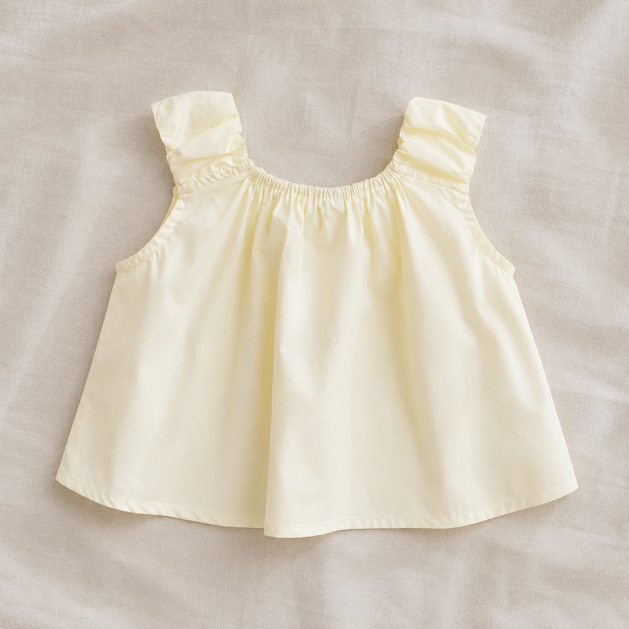 Back view of the Lila Bloom Set yellow sleeveless top with gathered shoulder straps.