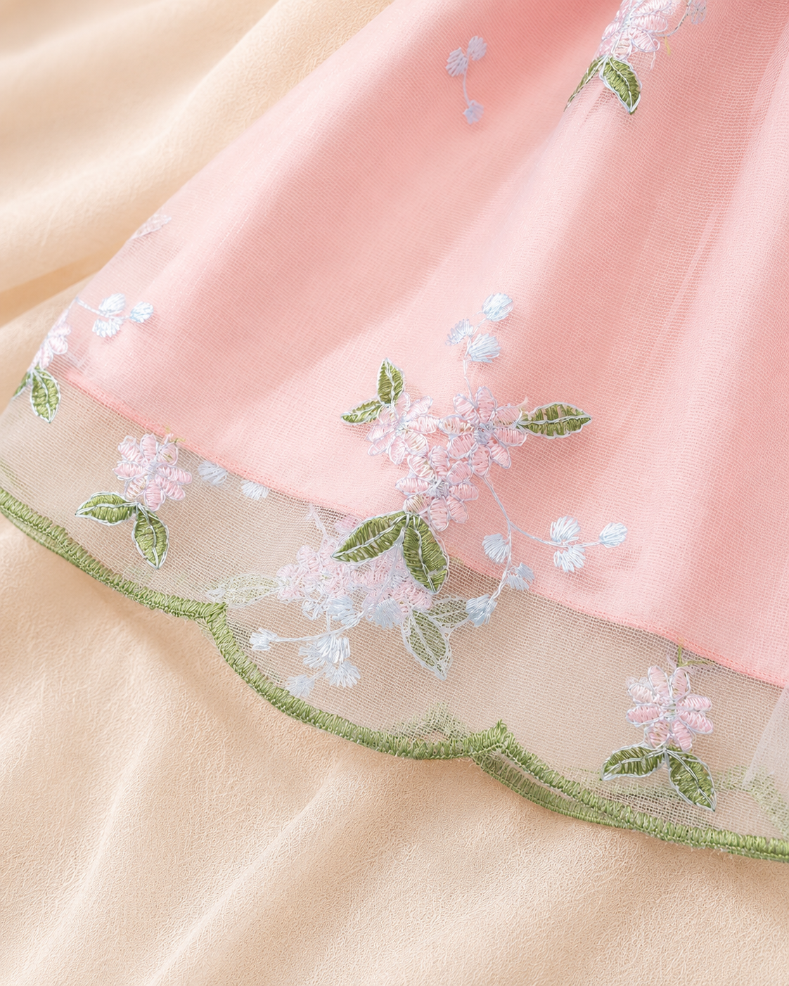Scalloped hem detail on Lottie Bloom floral tulle dress