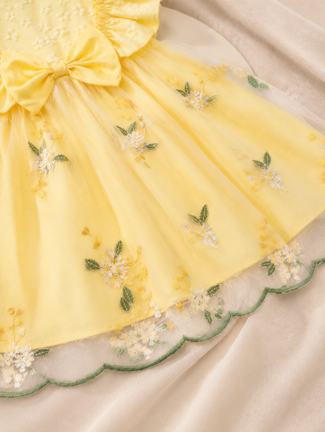 Floral embroidery detail on yellow Lottie Bloom party dress
