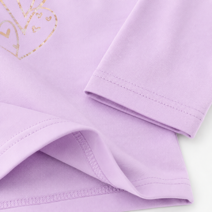 Close-up of the lavender cotton fabric, sleeve, and hem stitching.