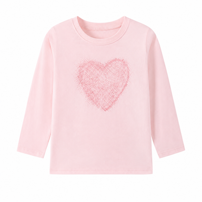 Front flat lay of the light pink girls cotton long sleeve tee with a soft pink heart graphic.