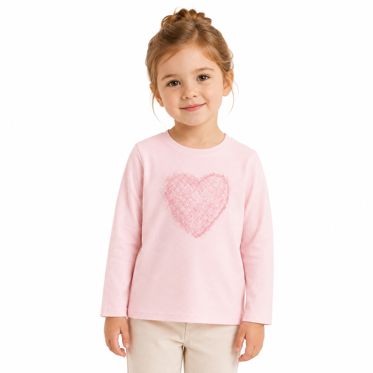 Girl model wearing the light pink heart graphic long sleeve cotton tee.