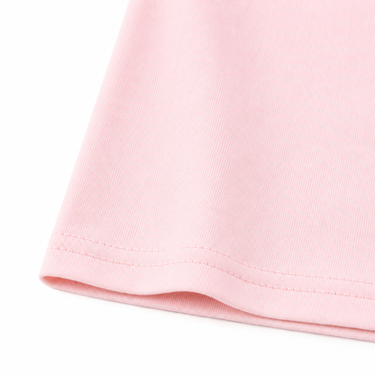 Close-up of the light pink cotton fabric and hem stitching.