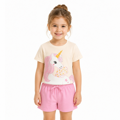 Girl model wearing the ivory T-shirt and pink shorts unicorn outfit set.